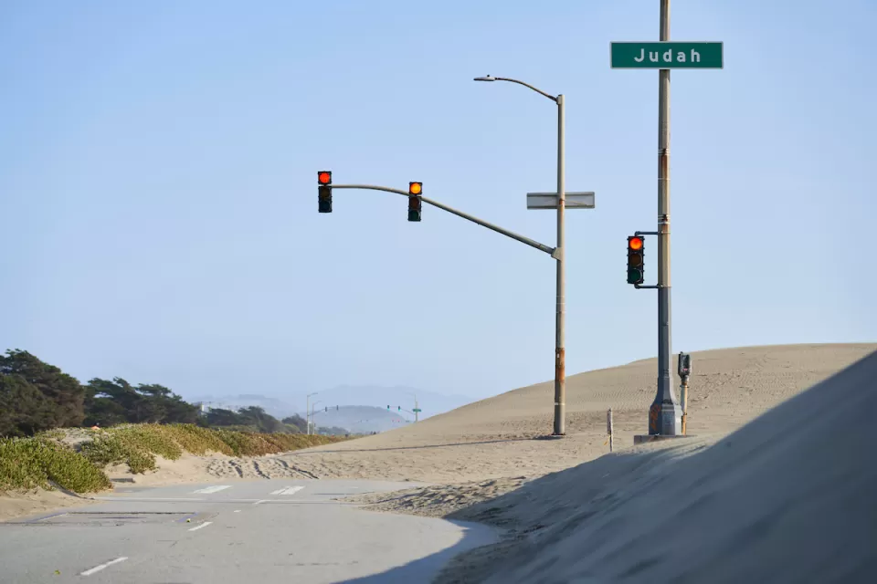 Great Highway roadway on San Francisco coast blocked by sand.